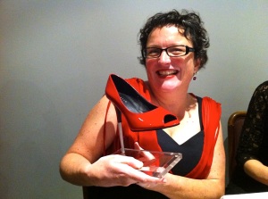 Winning grin with stiletto trophy. Photo: Eveylyn Tsitas